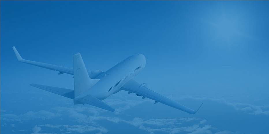 Commercial airplane flying above the clouds toward a bright sun in a clear blue sky.